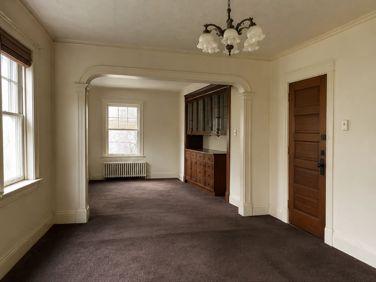 Demonstration living and dining area before renovation