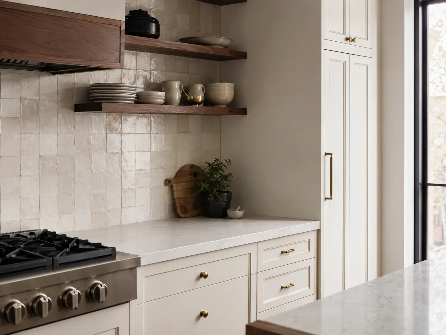 Representative cream and walnut kitchen cabinetry detail